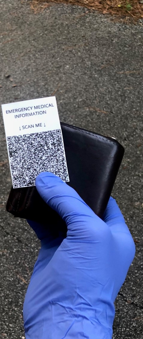 The right half of the cover image, a gloved hand holding an EQR card on a wallet