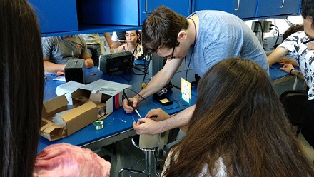 Me teaching a group of students how to solder