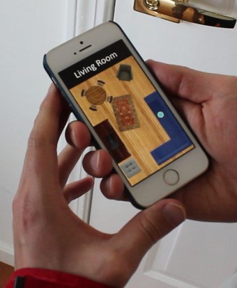 Smart phone displaying a schematic of a living room